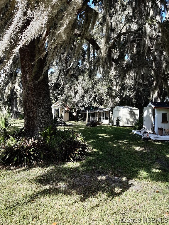 1780 Old Mission Road Edgewater, FL 32132 - Photo 43 of 55 a front view of a house with a yard