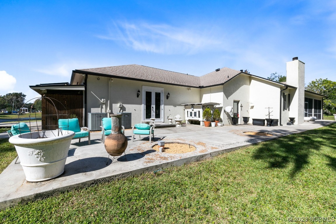 1780 Old Mission Road Edgewater, FL 32132 - Photo 44 of 55 a view of a house with backyard porch and sitting area