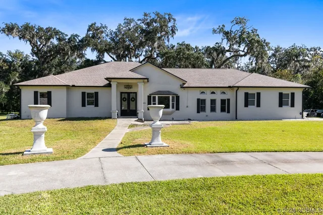 a front view of a house with swimming pool
