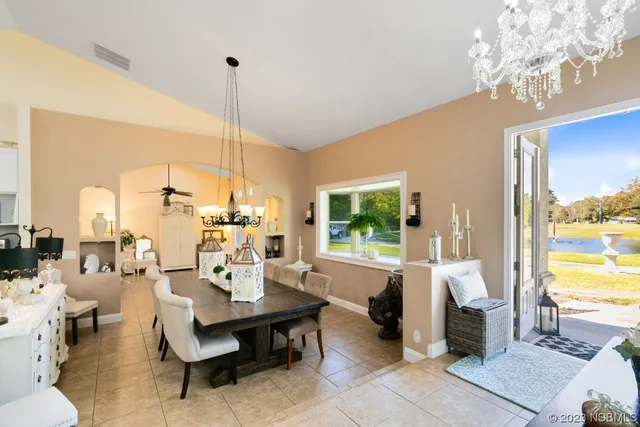 a view of a dining room with furniture window and outside view