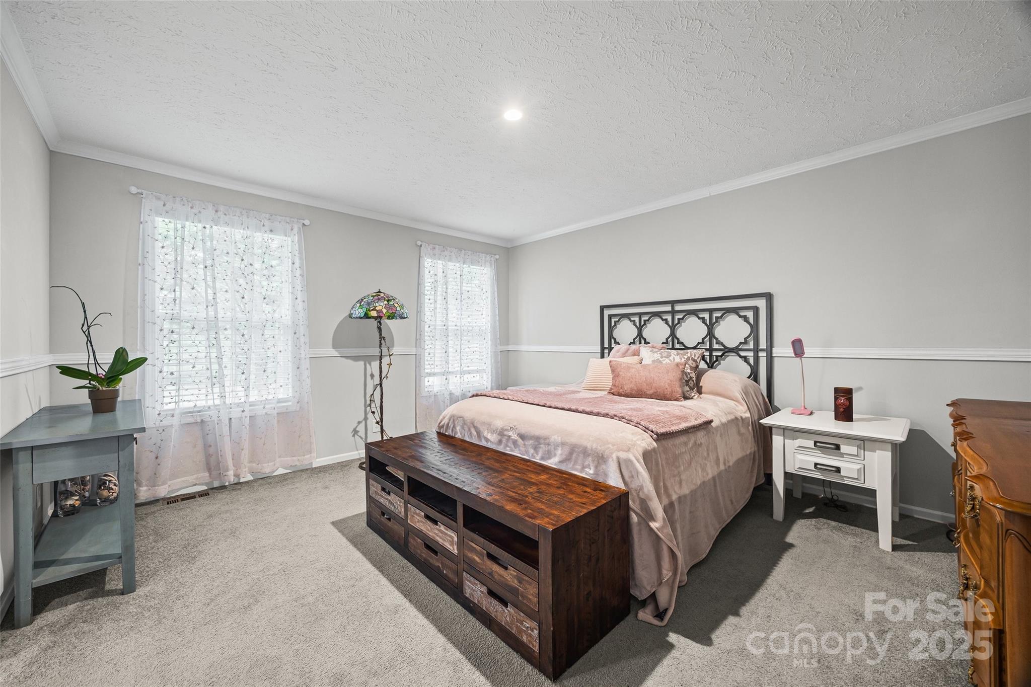 1804 Tom Joye Road Clover, SC 29710 - Photo 11 of 28 a bed room with a bed and a chair