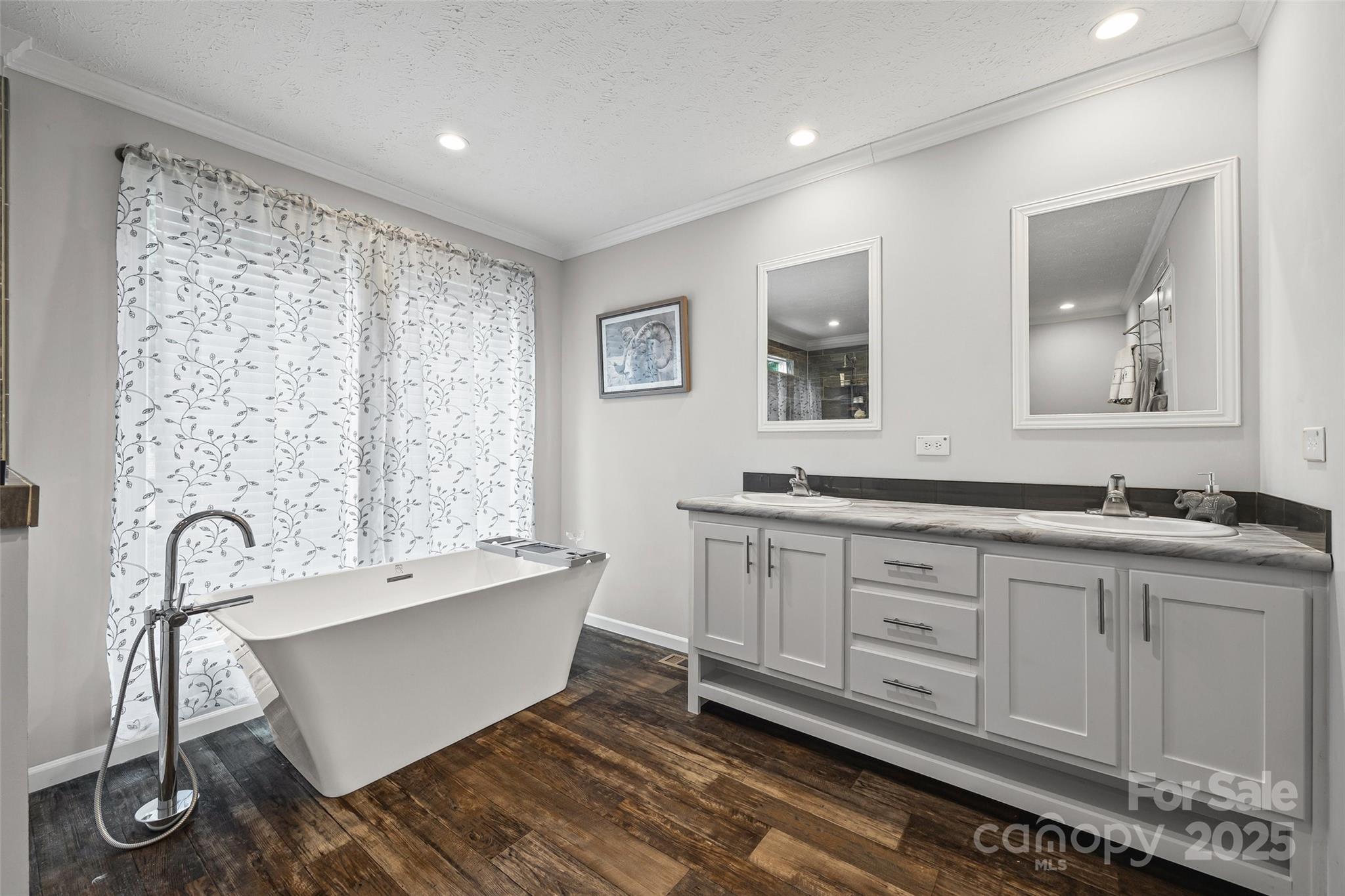 1804 Tom Joye Road Clover, SC 29710 - Photo 13 of 28 a bathroom with a double vanity sink and a bathtub