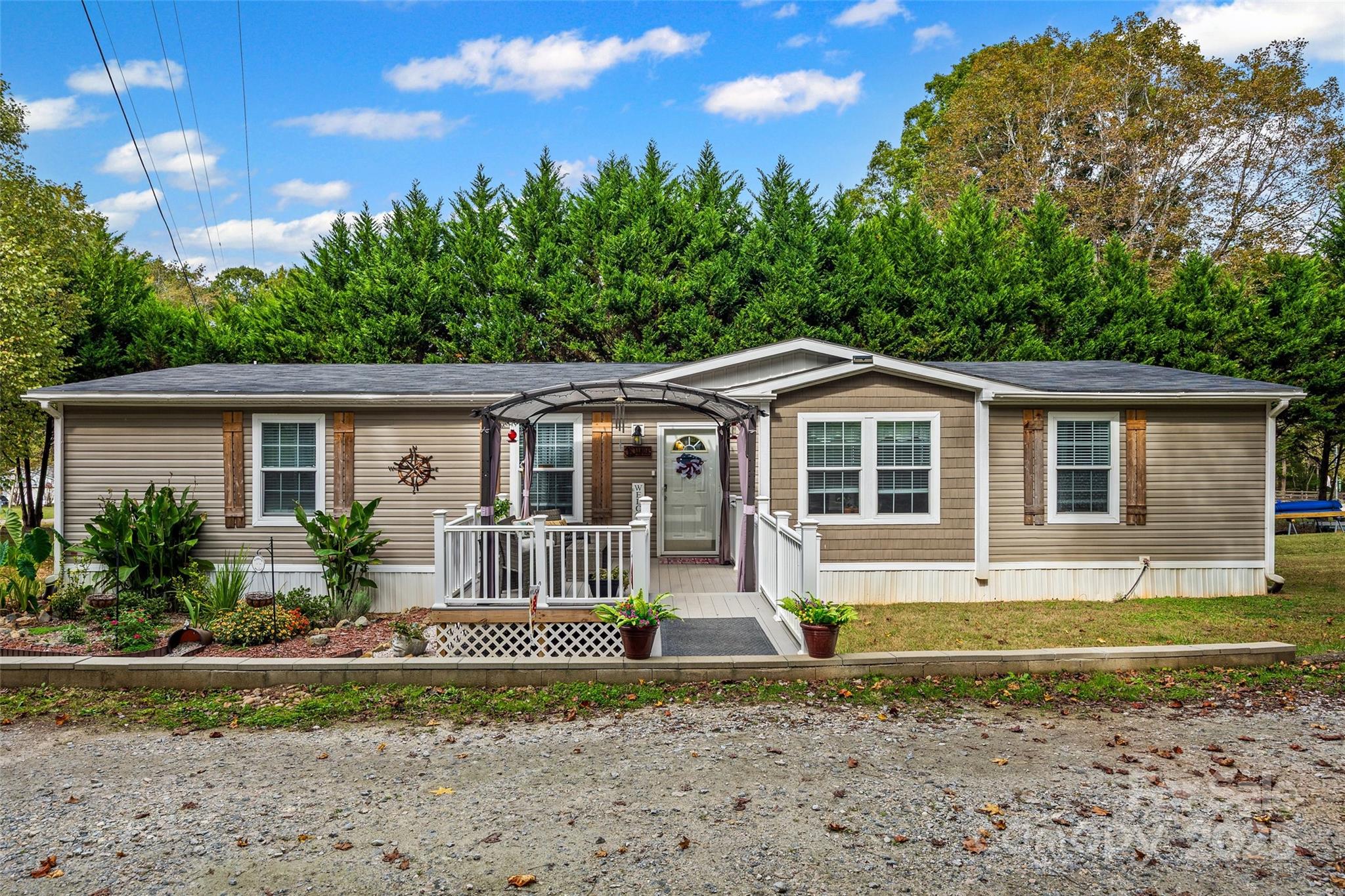 1804 Tom Joye Road Clover, SC 29710 - Photo 22 of 28 a front view of a house with garden