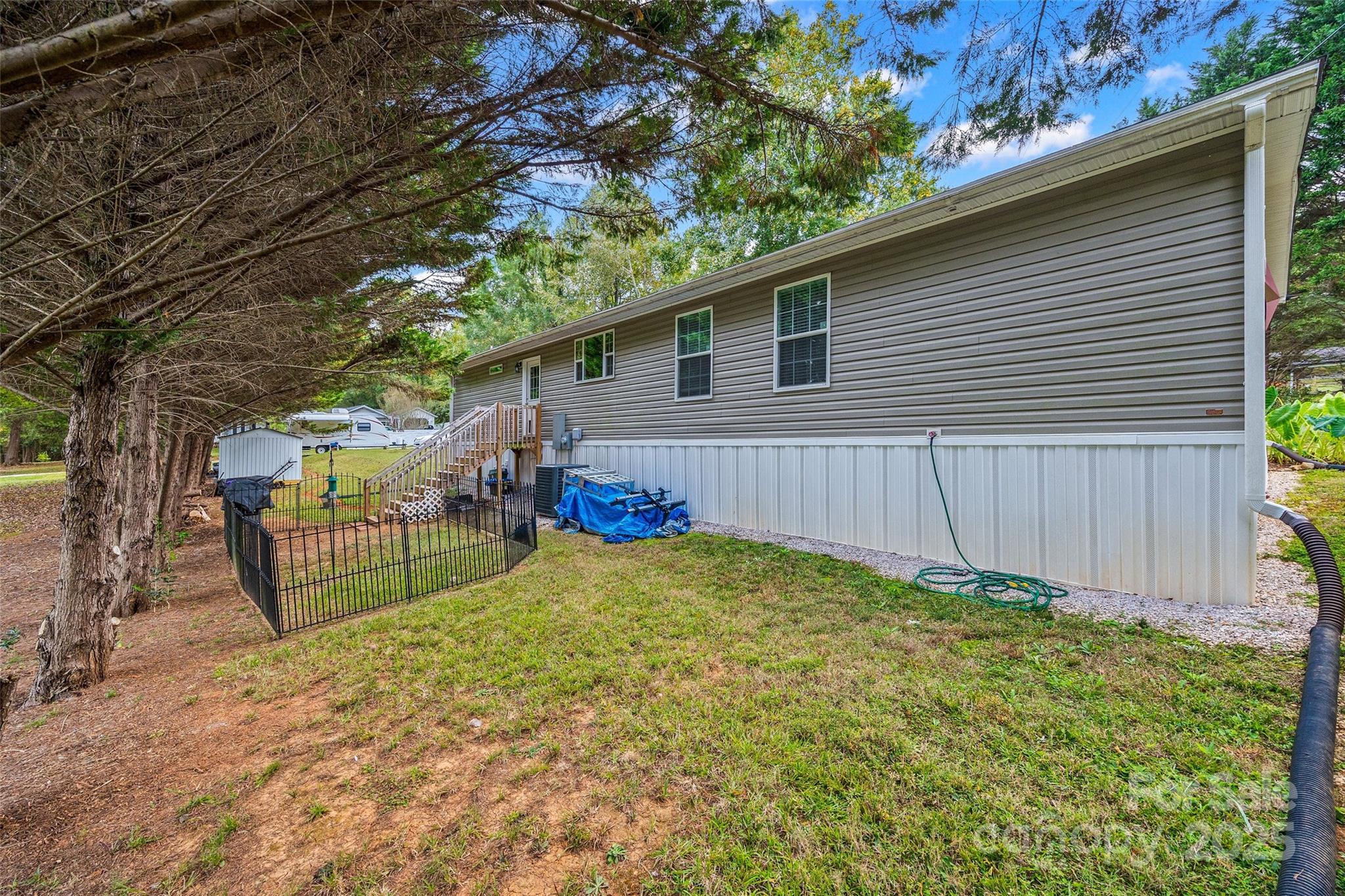 1804 Tom Joye Road Clover, SC 29710 - Photo 25 of 28 a view of backyard with outdoor seating and wooden fence