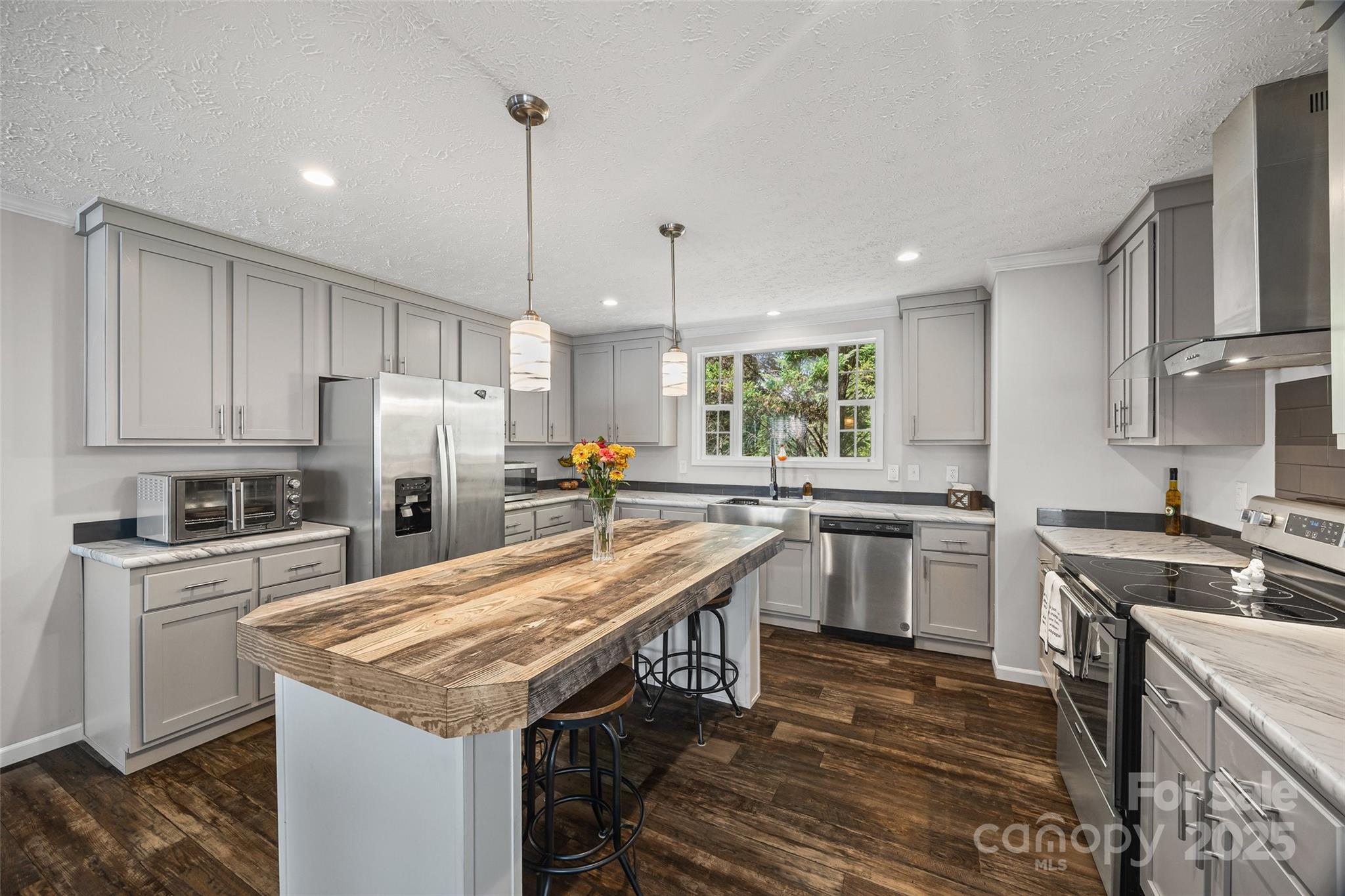 1804 Tom Joye Road Clover, SC 29710 - Photo 8 of 28 a kitchen with refrigerator cabinets and wooden floor