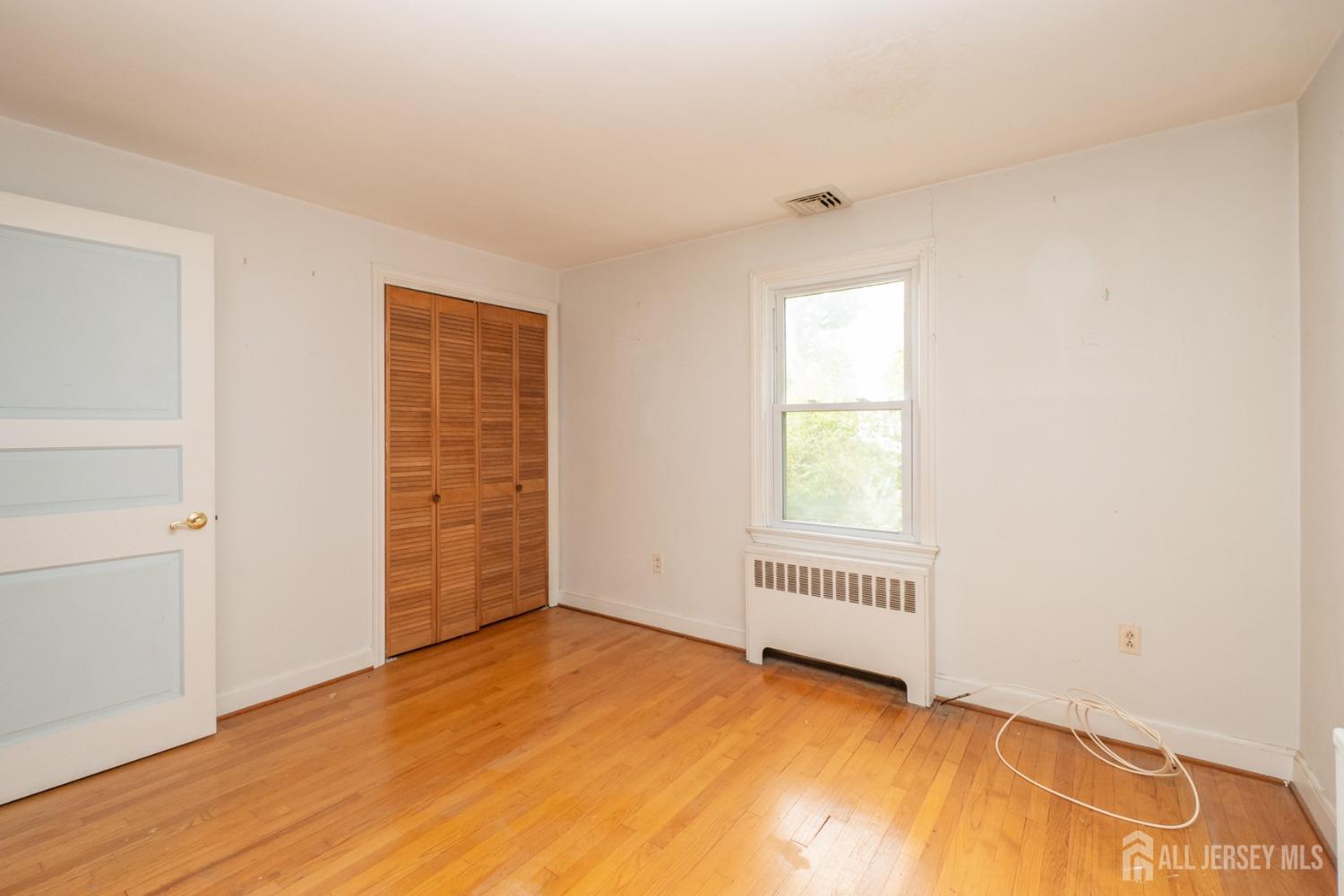 203 New Market Road Dunellen, NJ 08812 - Photo 28 of 44 an empty room with a natural light