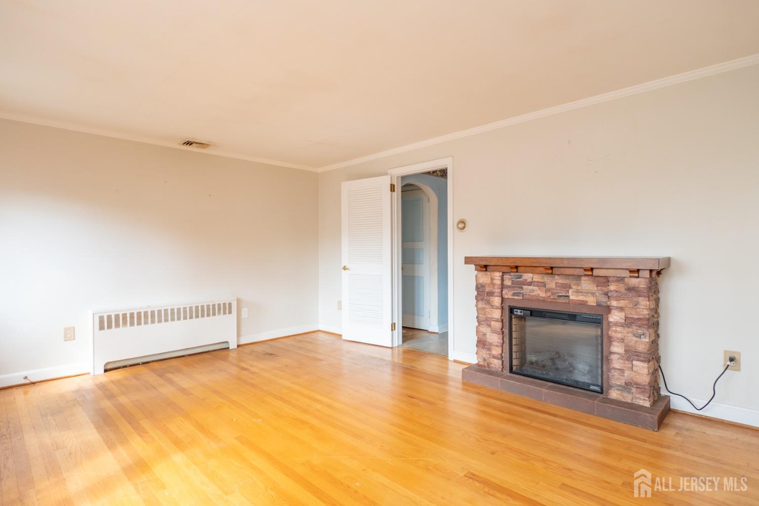 203 New Market Road Dunellen, NJ 08812 - Photo 4 of 44 a view of empty room with a fireplace