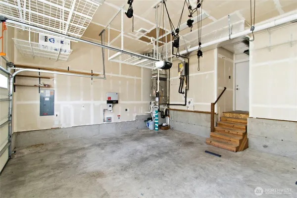 a view of a room with stairs and white walls