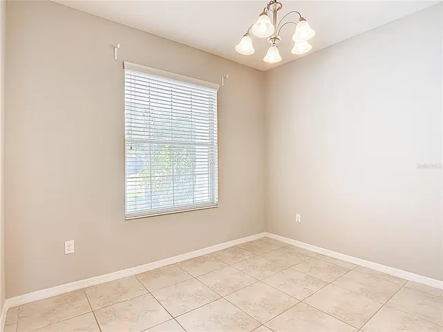 a view of a livingroom with furniture and a chandelier