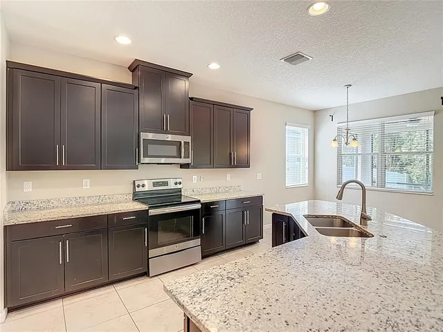 a bathroom with a sink a mirror and a toilet