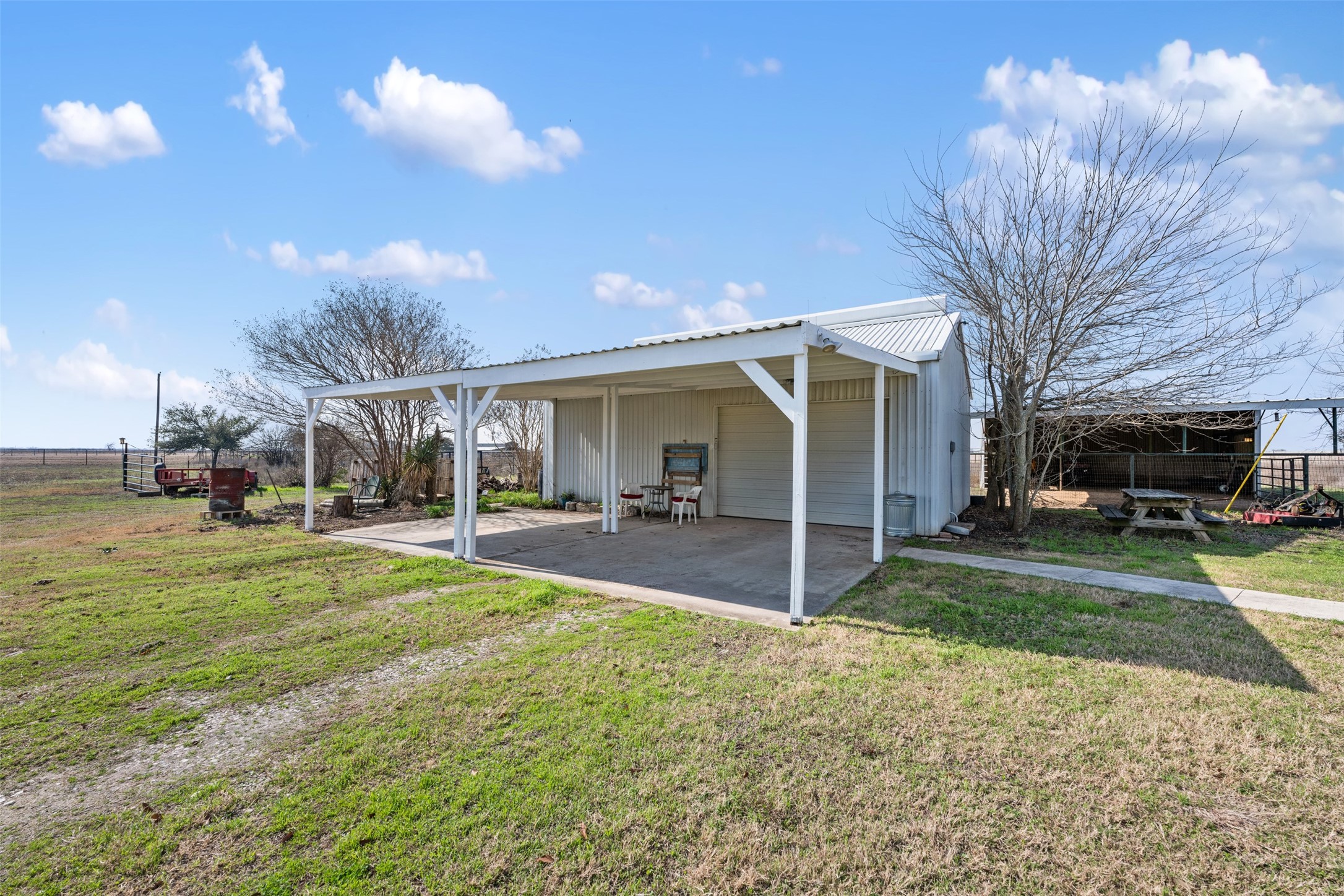 6501 County Road 239 Jarrell, TX 76537 - Photo 34 of 40 2 car garage with attached 2 carport spaces
