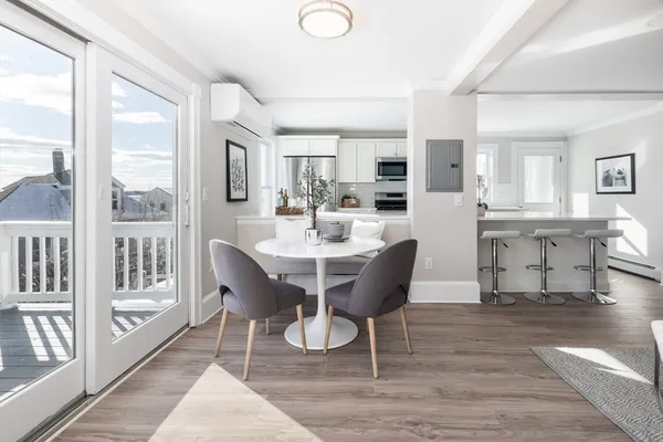 a view of a dining room with furniture window and wooden floor
