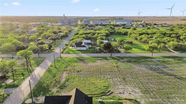 a view of a garden with lawn chairs