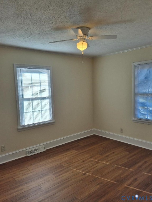 3191 Sandy River Road Burkeville, VA 23922 - Photo 12 of 15 an empty room with wooden floor and windows
