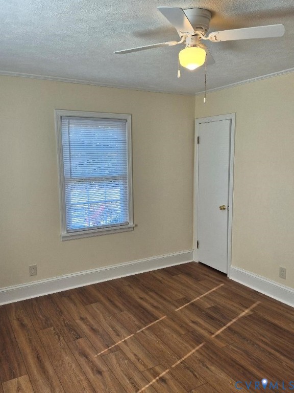 3191 Sandy River Road Burkeville, VA 23922 - Photo 15 of 15 en empty room with wooden floor and fan