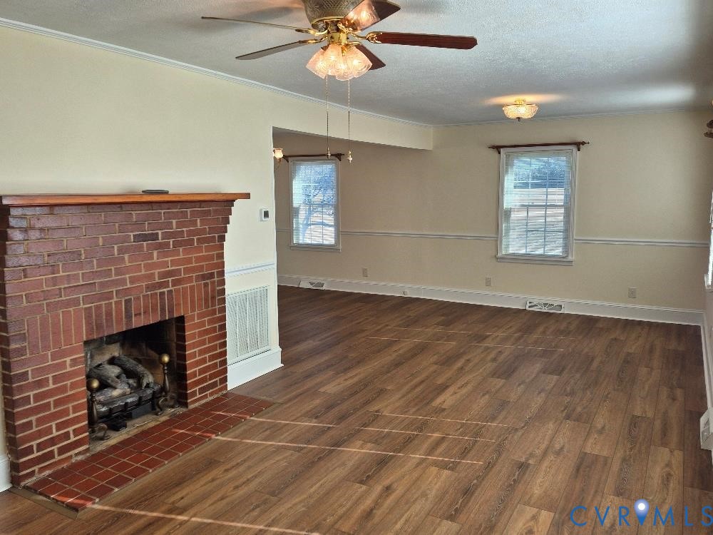 3191 Sandy River Road Burkeville, VA 23922 - Photo 3 of 15 an empty room with windows and fireplace