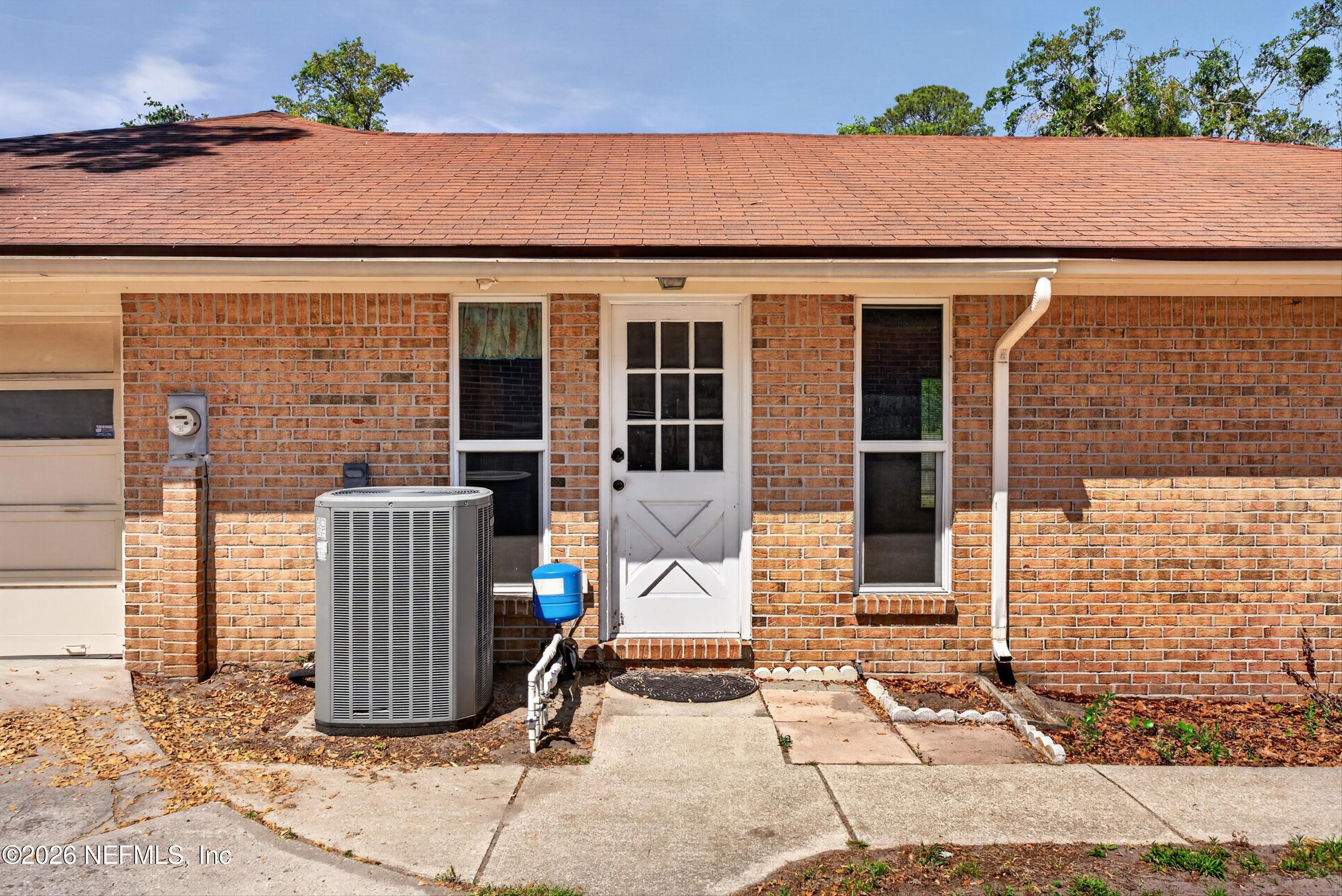 5353 Riverton Road Jacksonville, FL 32277 - Photo 44 of 57 Service Door to Utility Room