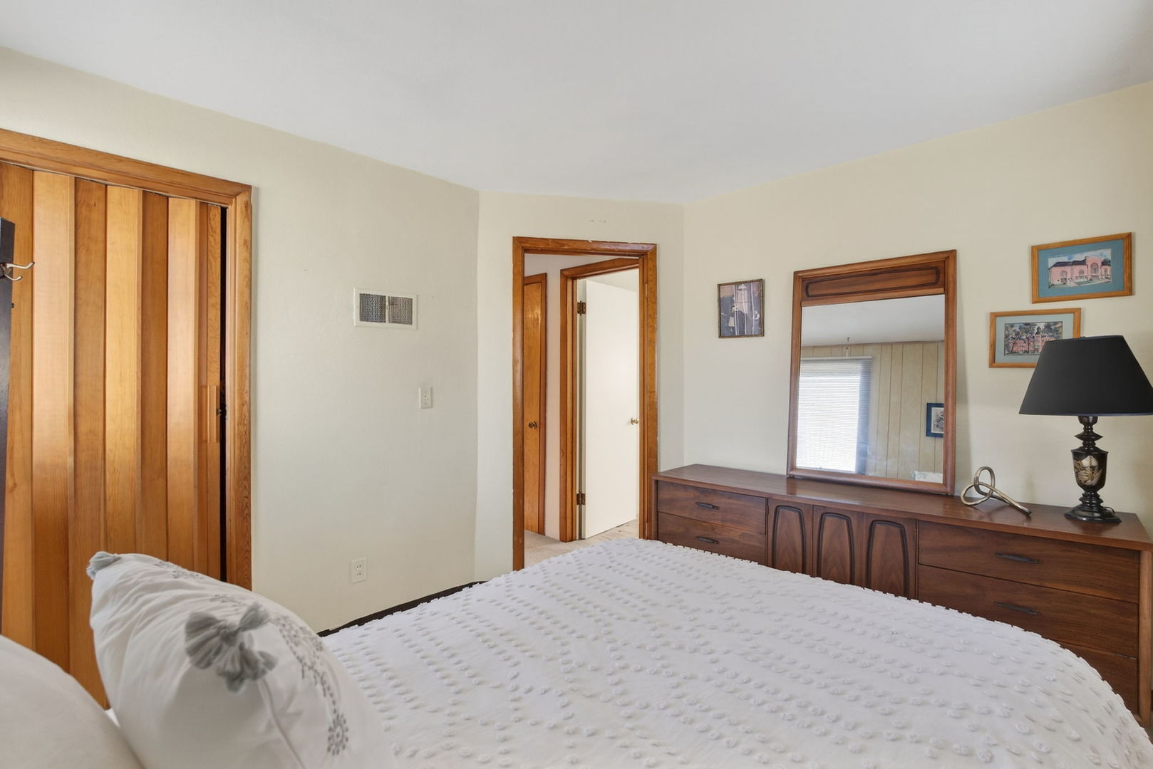 3818 15th Street Moline, IL 61265 - Photo 14 of 23 a bedroom with a balcony a bed and a dresser in it