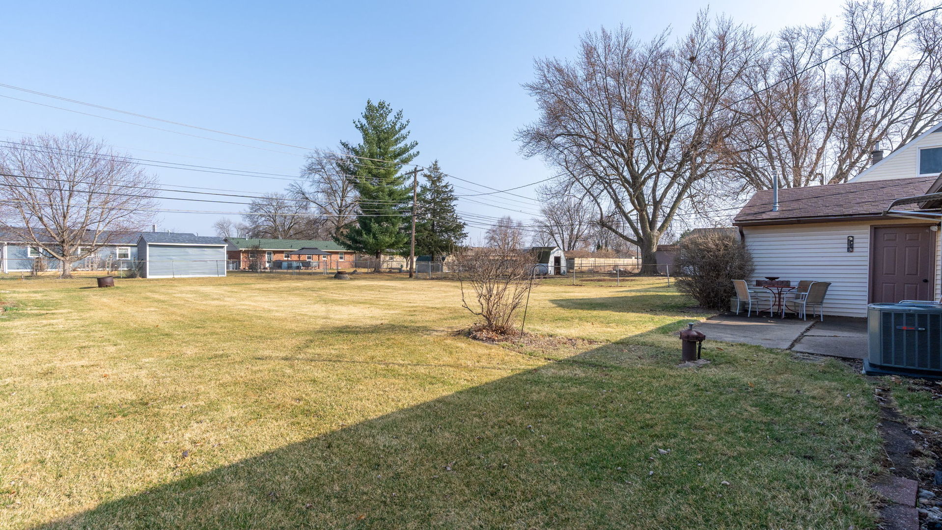 3818 15th Street Moline, IL 61265 - Photo 20 of 23 a view of a swimming pool with a table and chairs