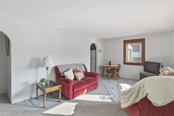 a living room with furniture and a window