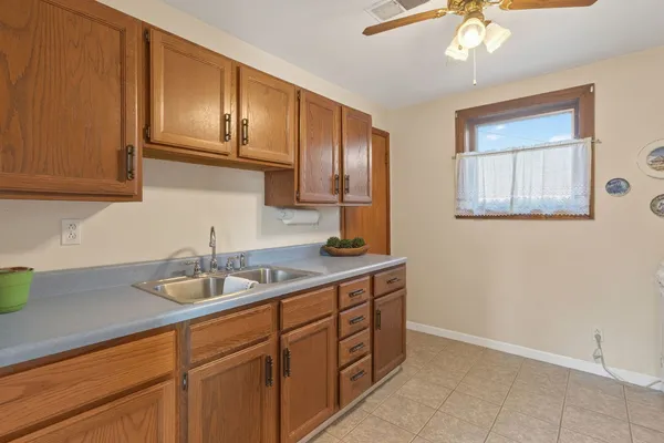 a kitchen with a sink and cabinets