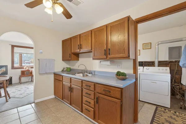 a kitchen with a cabinets and appliances