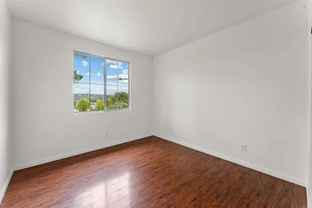 a view of cabinets and wooden floor