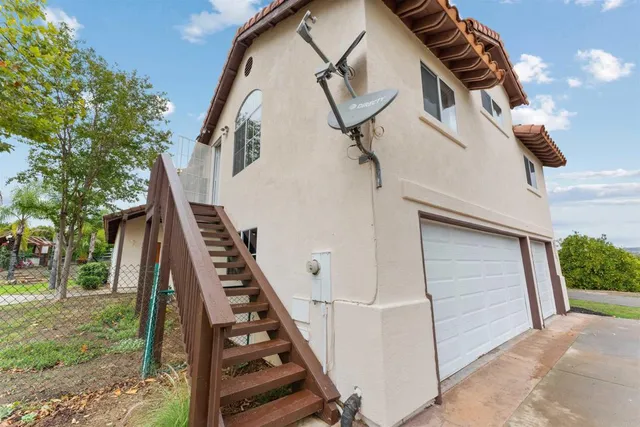 a view of a house with swimming pool and sitting area