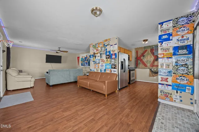 a bedroom with furniture and a wooden floor