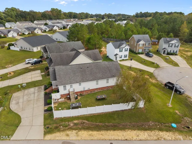 an aerial view of a house with a garden