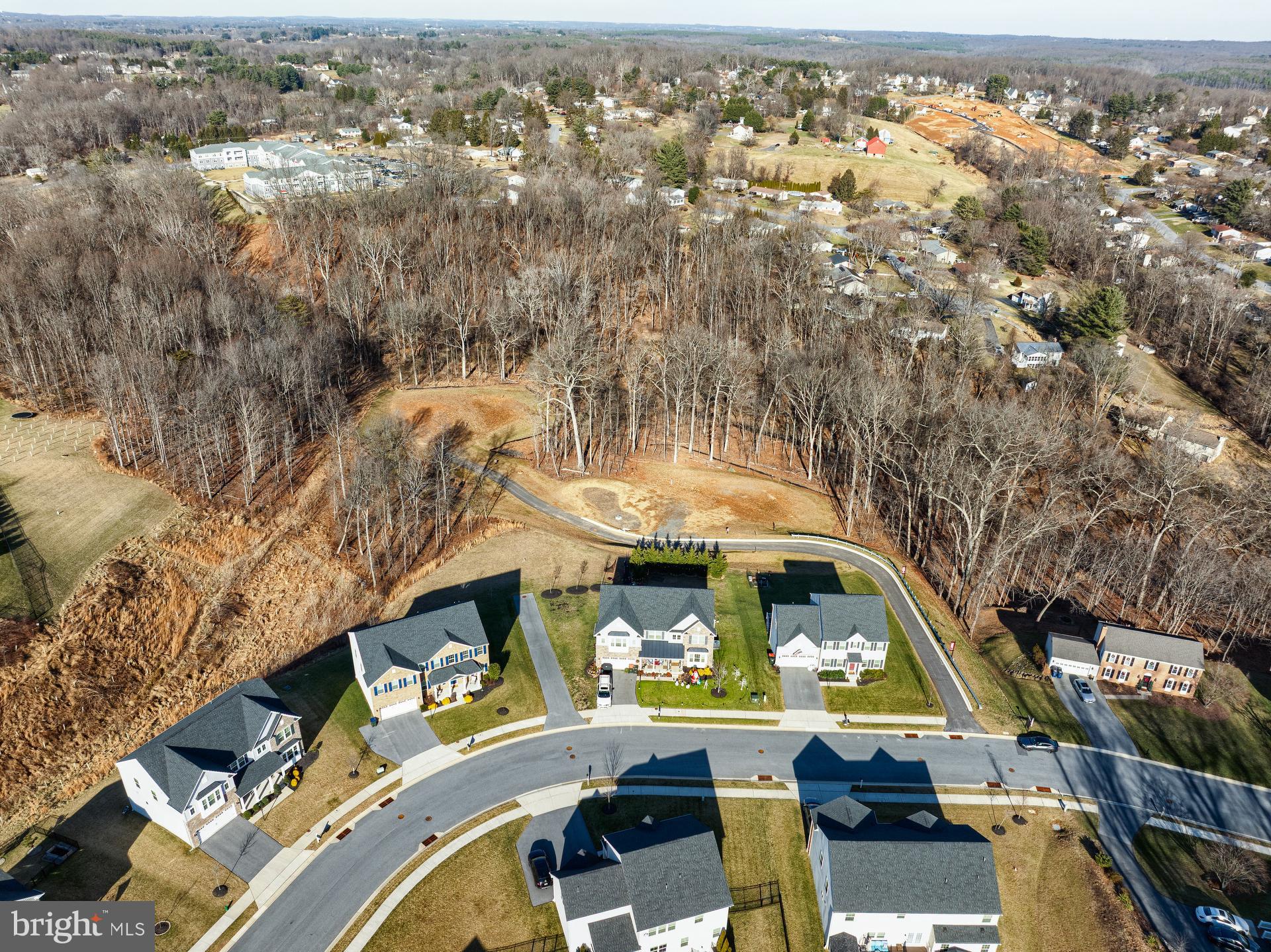 6142 Snowdens Run Road, Unit COVINGTON Eldersburg, MD 21784 - Photo 45 of 48 an aerial view of a house with a swimming pool