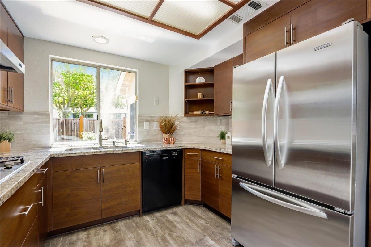 908 Springview Circle San Ramon, CA 94583 - Photo 12 of 31 a kitchen with a refrigerator a sink and cabinets