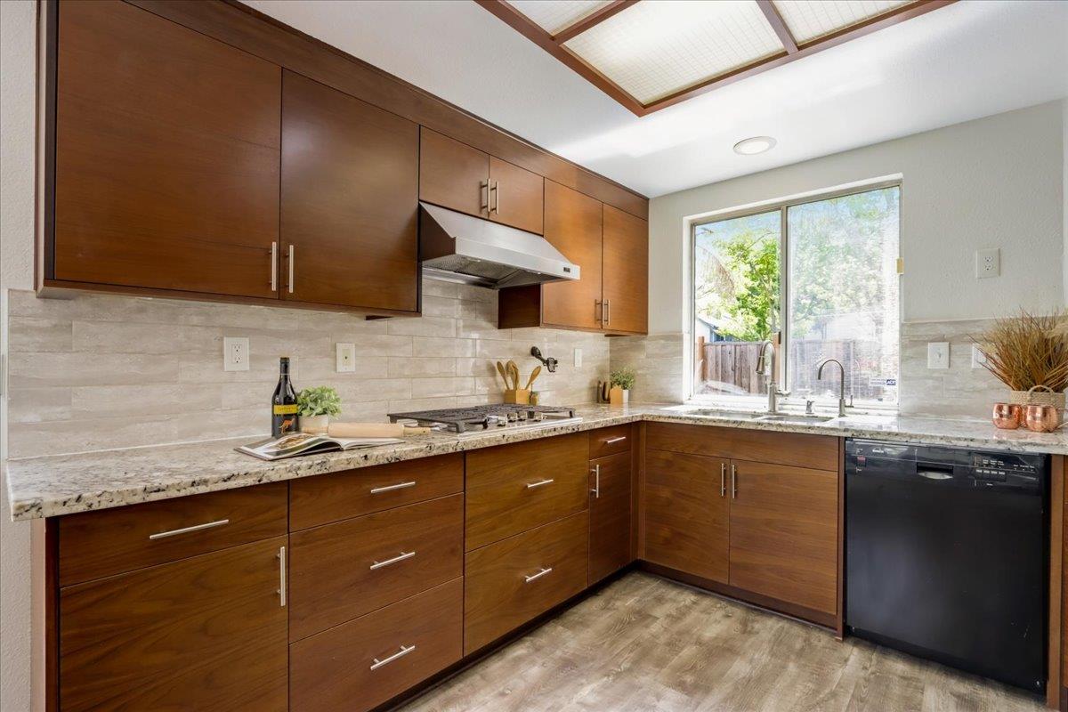 908 Springview Circle San Ramon, CA 94583 - Photo 13 of 31 a kitchen with stainless steel appliances granite countertop a sink a stove a refrigerator cabinets and a window