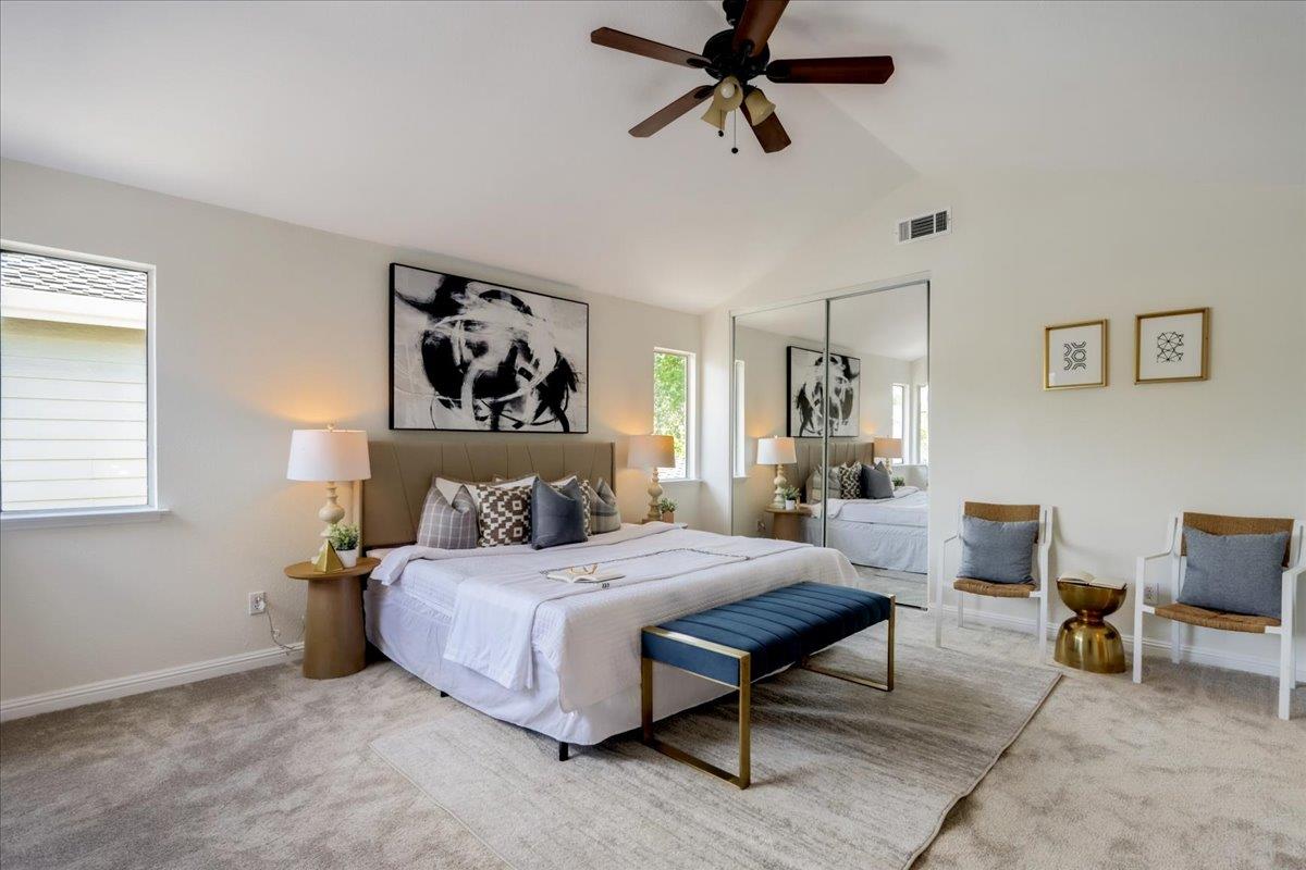 908 Springview Circle San Ramon, CA 94583 - Photo 18 of 31 a bedroom with a bed and a chandelier