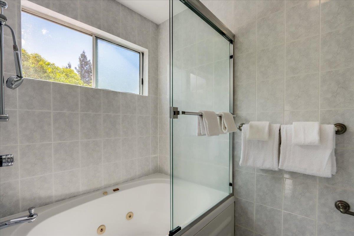 908 Springview Circle San Ramon, CA 94583 - Photo 19 of 31 a bathroom with a bathtub and a shower