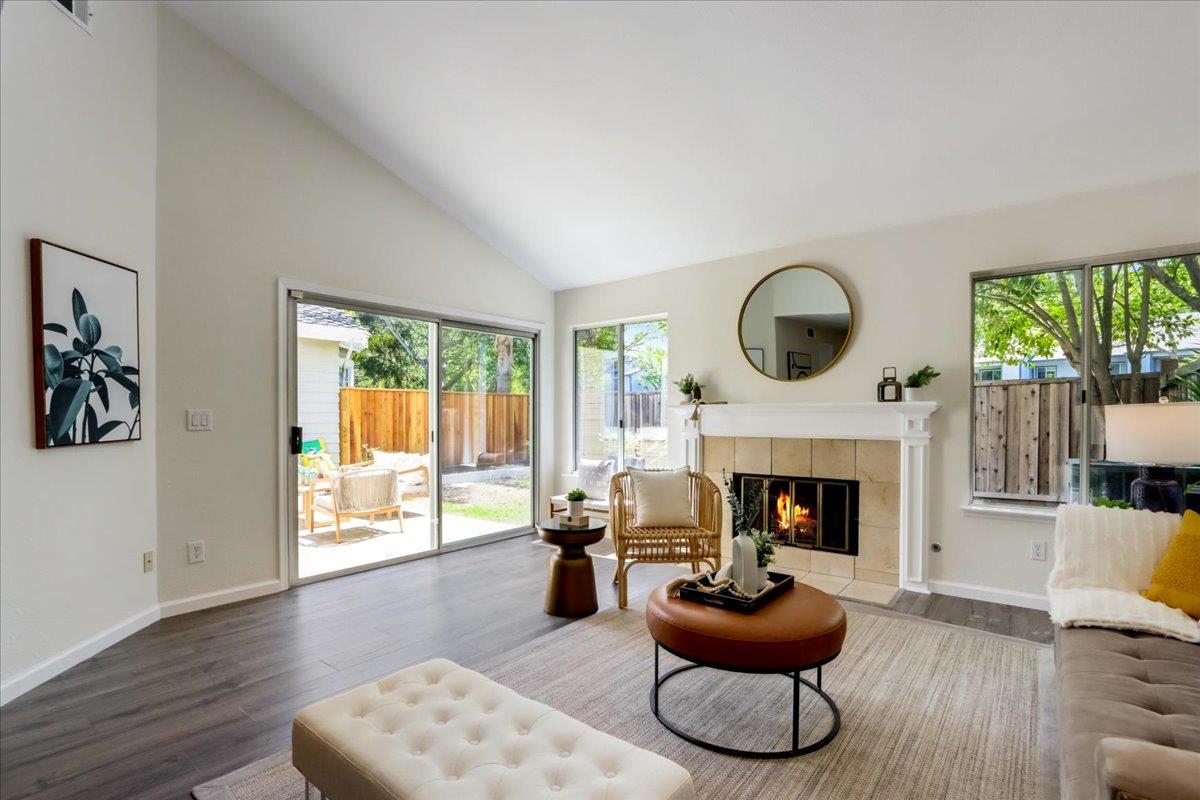 908 Springview Circle San Ramon, CA 94583 - Photo 2 of 31 a living room with furniture a fireplace and a large window