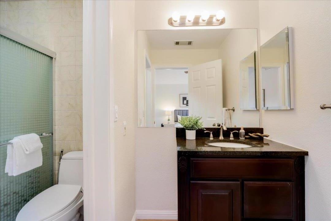 908 Springview Circle San Ramon, CA 94583 - Photo 24 of 31 a bathroom with a sink a toilet and mirror