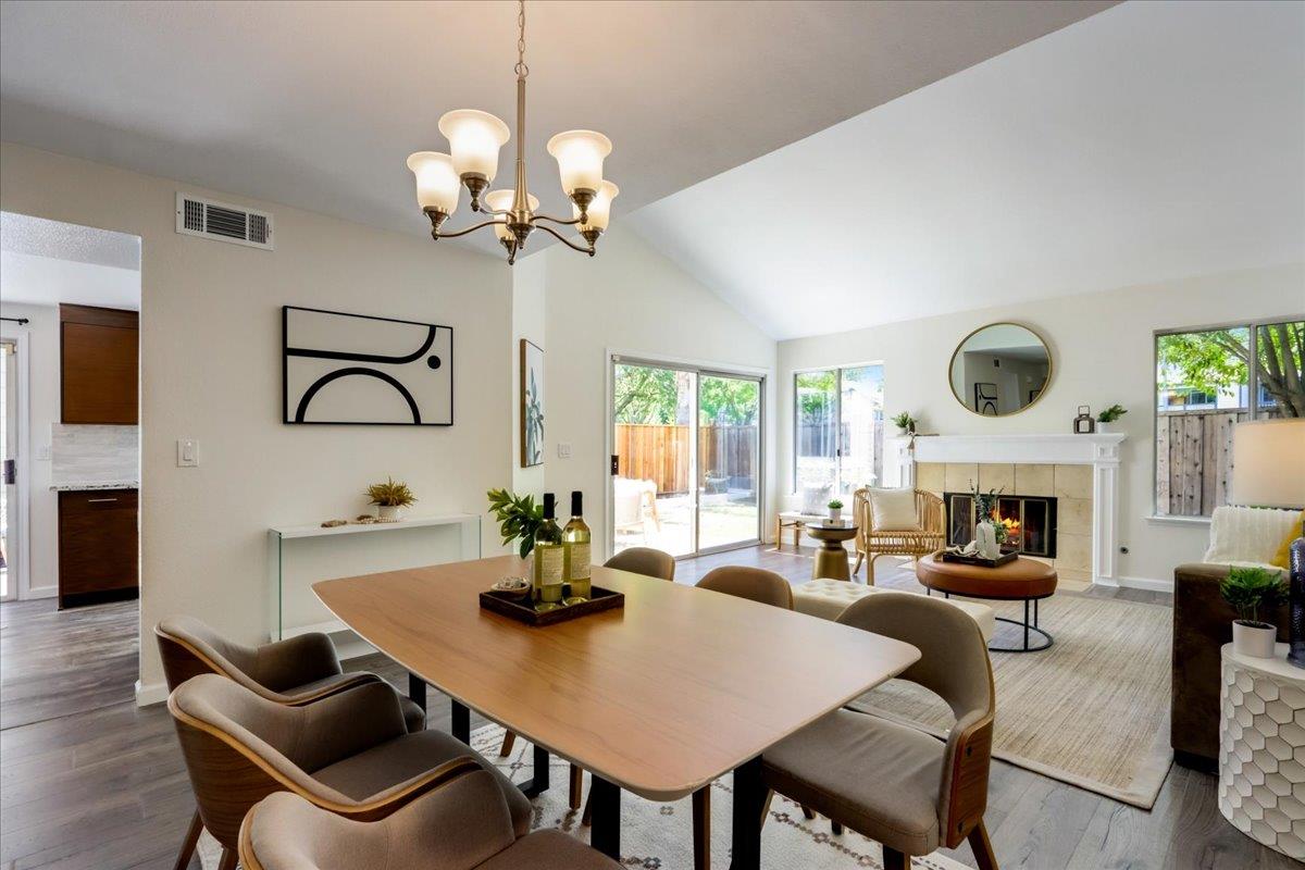 908 Springview Circle San Ramon, CA 94583 - Photo 4 of 31 a view of a dining room with furniture a fireplace and wooden floor