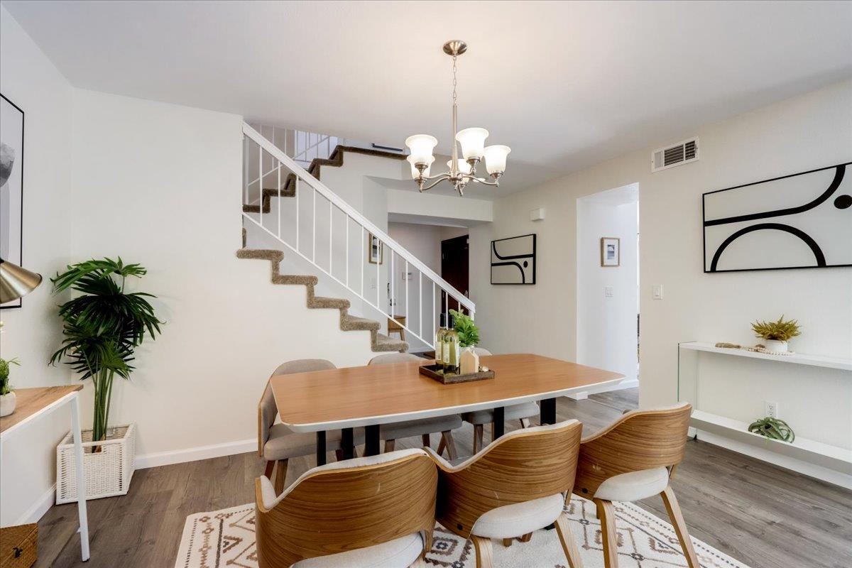 908 Springview Circle San Ramon, CA 94583 - Photo 9 of 31 a view of a livingroom with furniture a chandelier and wooden floor