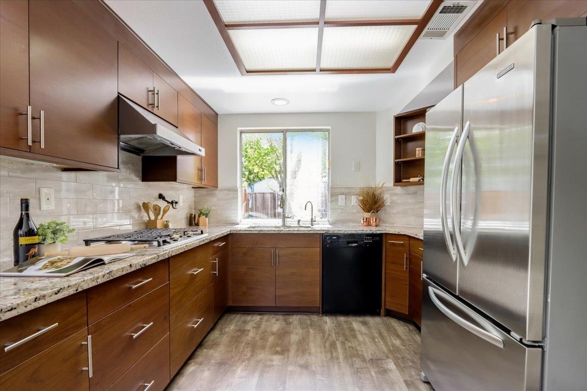 908 Springview Circle San Ramon, CA 94583 - Photo 10 of 31 a kitchen with stainless steel appliances granite countertop a sink stove and refrigerator