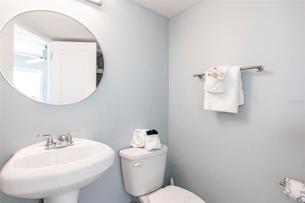 6020 Midnight Pass Road, Unit 49 Sarasota, FL 34242 - Photo 11 of 38 a bathroom with a sink mirror and toilet