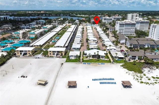 a view of swimming pool with seating area and barbeque oven