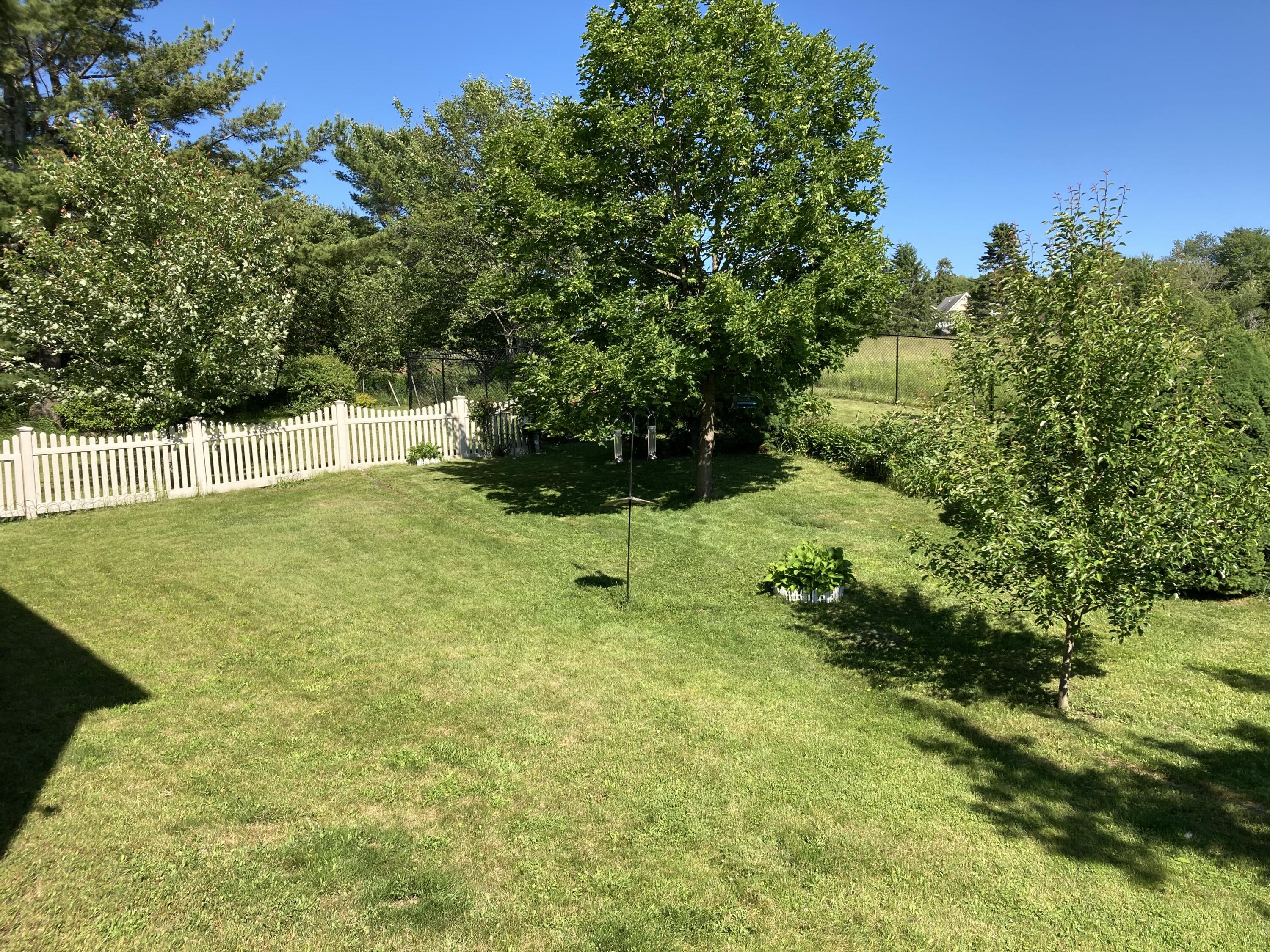 32 Boulder Cv Way Lamoine, ME 04605 - Photo 25 of 37 Back lawn.