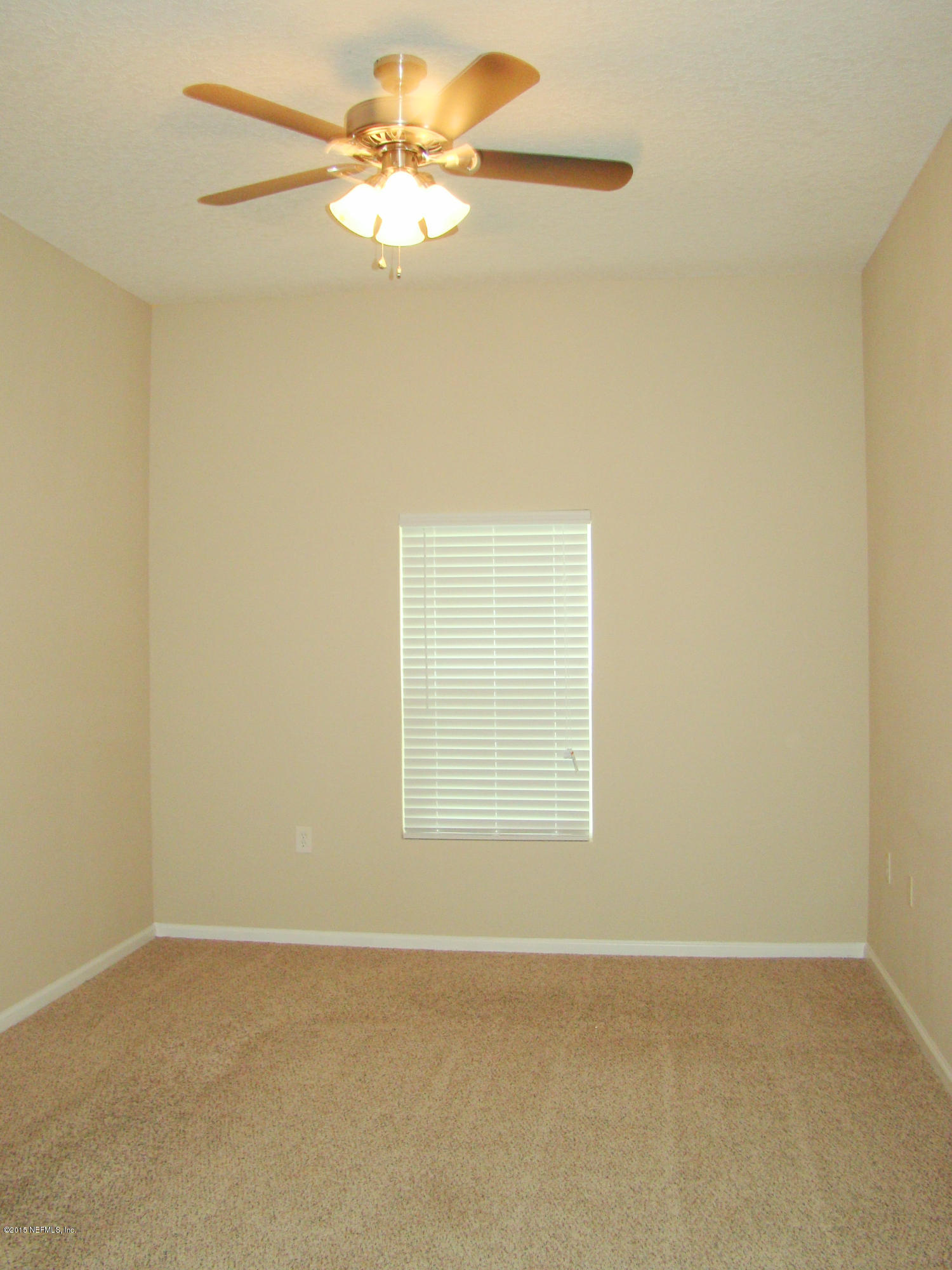 7920 Merrill Road, Unit 1504 Jacksonville, FL 32277 - Photo 7 of 12 an empty room with a window