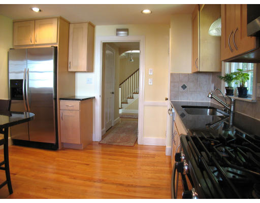 67 Scott Road Belmont, MA 02478 - Photo 8 of 12 a kitchen with stainless steel appliances granite countertop a sink stove and refrigerator