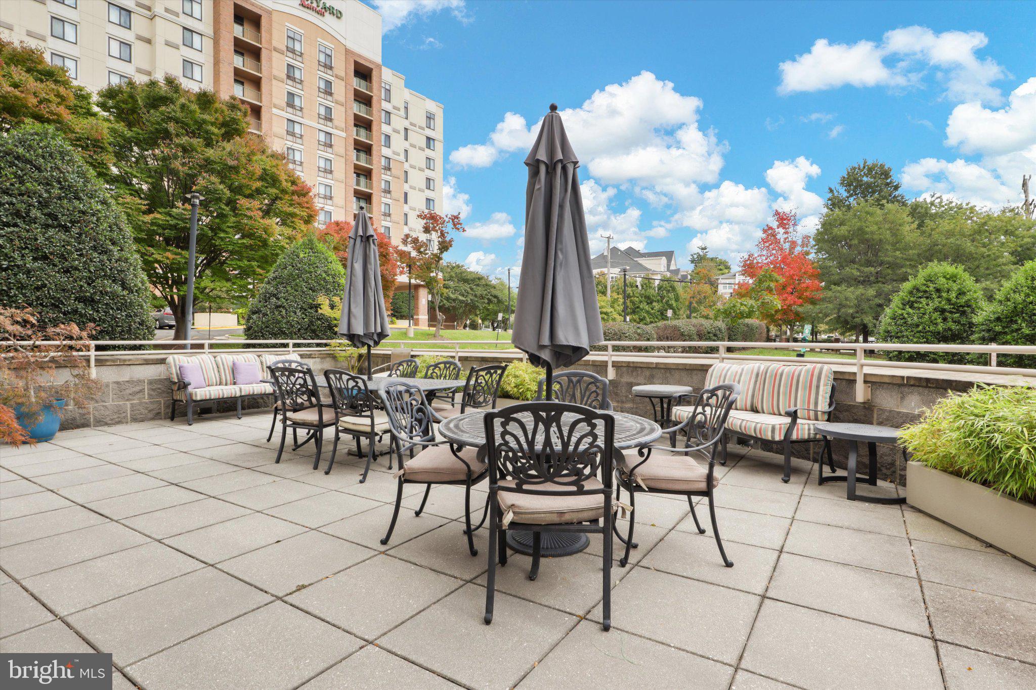 2726 Gallows Road, Unit 1506 Vienna, VA 22180 - Photo 27 of 35 Charming patio with lush greenery.