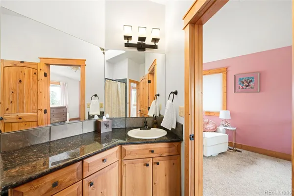 a bathroom with a shower and a curtain