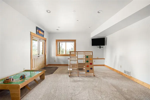 a view of room with window and ceiling fan