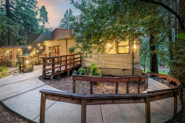 a view of a wooden chairs on the deck