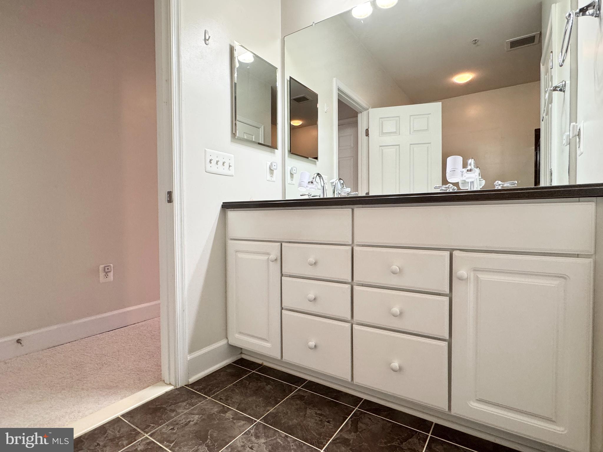 2396 Brookmoor Lane, Unit 401A Woodbridge, VA 22191 - Photo 15 of 26 a bathroom with a sink and a mirror